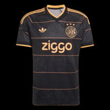 Kitted Up Ajax 2026/2027 kids away football jersey in black with gold accents and subtle graphic pattern