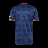 Back view of Kitted Up Arsenal 2026/2027 kids away football jersey in navy blue with geometric pattern and red trim.