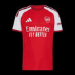 Kitted Up Arsenal F.C. 2026/2027 kids home soccer jersey in red and white with club crest and sponsor logos.