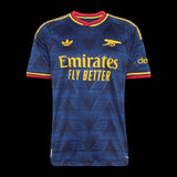 Kitted Up Arsenal FC navy blue football jersey with gold accents and red trim on a black background