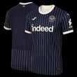Kitted Up Brentford 2026/2027 away football jersey in navy blue with white pinstripes and cream trim details.