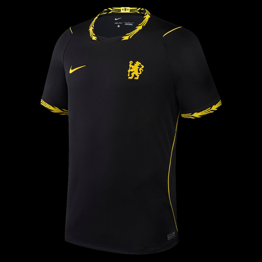 Kitted Up Chelsea 2026/2027 away football jersey in black with yellow accents and patterned collar and sleeve cuffs.