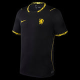 Kitted Up Chelsea 2026/2027 kids away jersey in black with yellow lion crest, Nike swoosh, and patterned trim.
