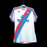 Kitted Up Crystal Palace 2026/2027 kids home football shirt in white with red and blue diagonal sash design