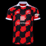 Kitted Up Fulham 2026/2027 kids away football jersey featuring a red and black checkered pattern and white collar.