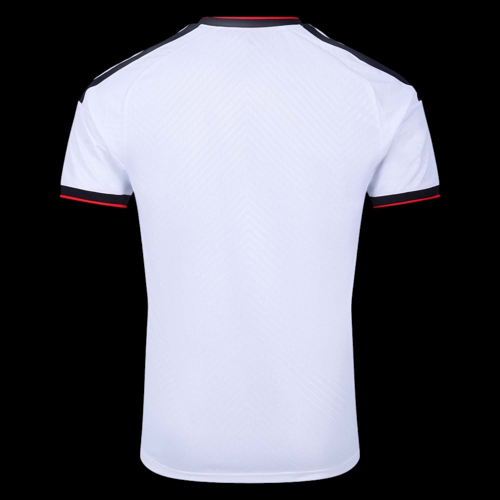 Back view of Kitted Up Fulham 2026/2027 kids home jersey in white with black and red sleeve and collar trim
