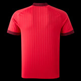 Back view of the red Kitted Up Lyon 2026/2027 away football jersey with patterned collar and sleeve cuffs.