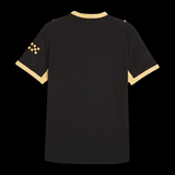 Back view of Kitted Up Manchester City 2026/2027 away football jersey in black with yellow trim and sleeve details.