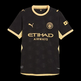 Kitted Up Manchester City 2026/2027 away jersey in black with gold accents and a subtle bee pattern