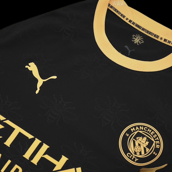 Kitted Up Manchester City 2026/2027 kids away jersey in black with gold bee pattern and club crest