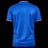 Back view of Kitted Up Manchester United 2026/2027 away jersey in blue with red and white sleeve trim details.