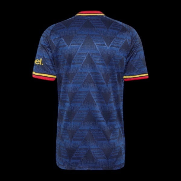 Back view of Kitted Up Manchester United 2026/2027 kids home jersey in dark blue with geometric pattern and red trim.
