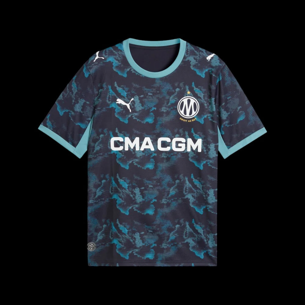 Kitted Up Marseille 2026/2027 kids away football jersey in dark blue with a teal abstract pattern and white logos.