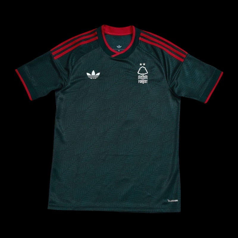 Kitted Up Nottingham Forest 2026/2027 kids away jersey in dark green with red accents and white logo details.